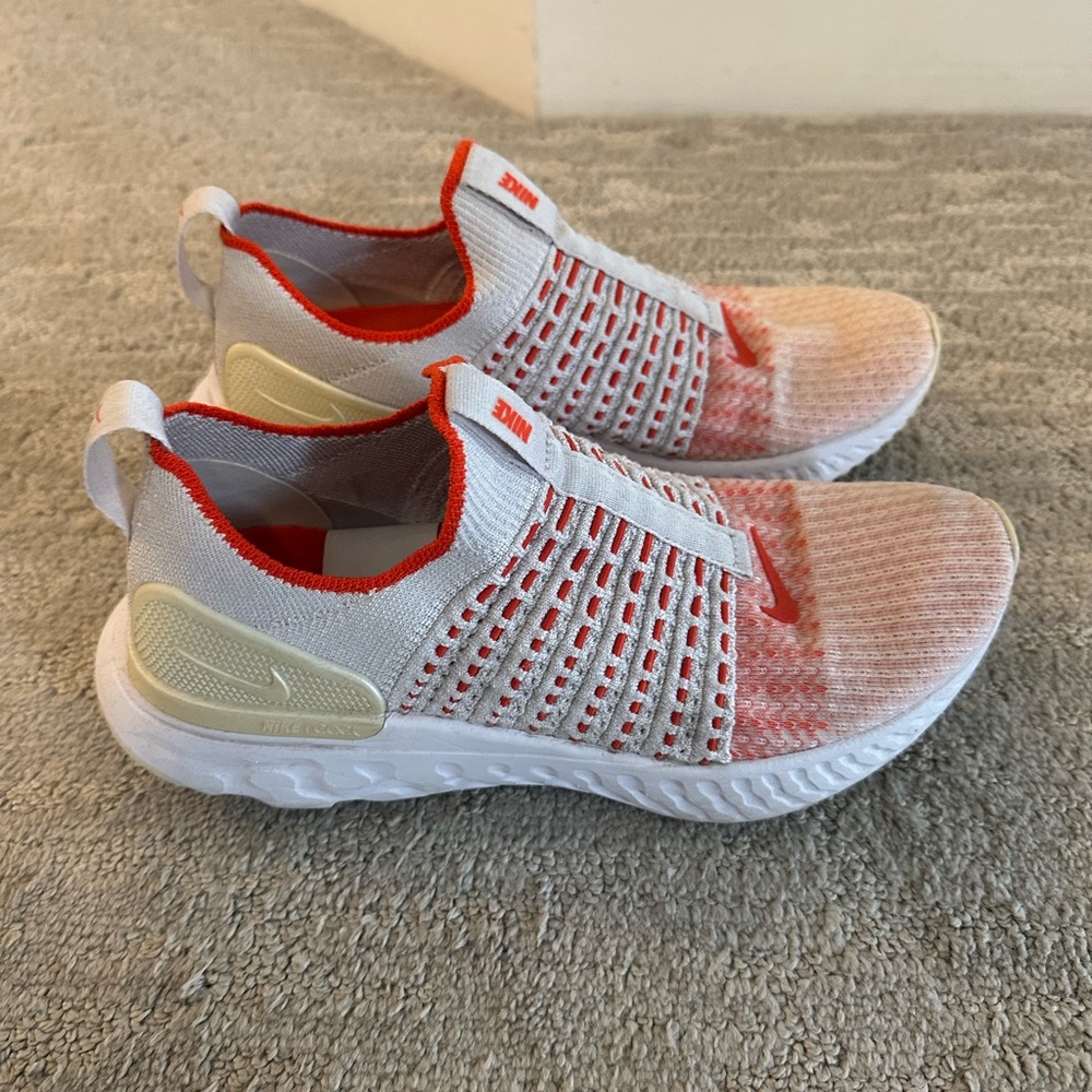 Nike White and Orange Flyknit Sneakers